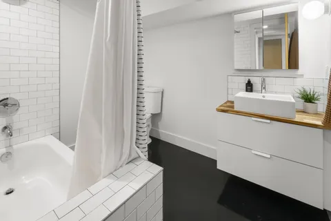 a bathroom with a sink and a bathtub