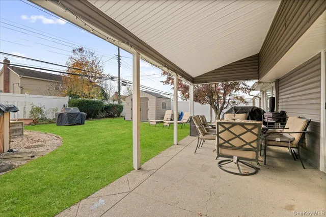 a view of a porch with furniture and garden