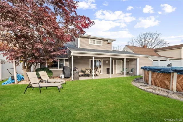 a view of a house with a yard porch and sitting area