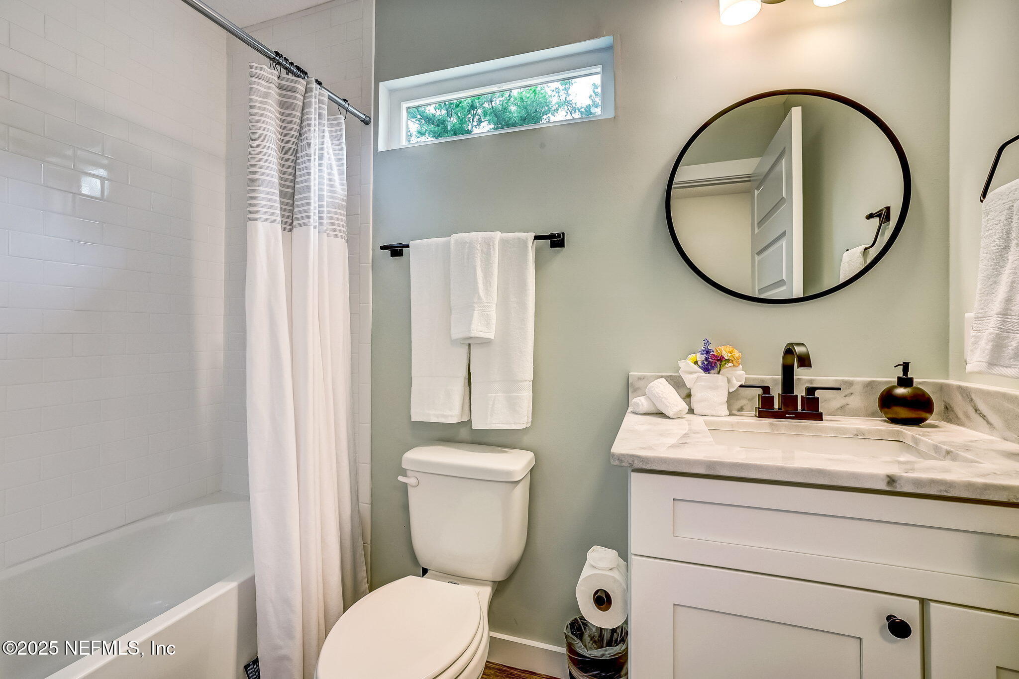 44 Hildreth Drive St. Augustine, FL 32084 - Photo 27 of 63 a bathroom with a granite countertop toilet sink and mirror
