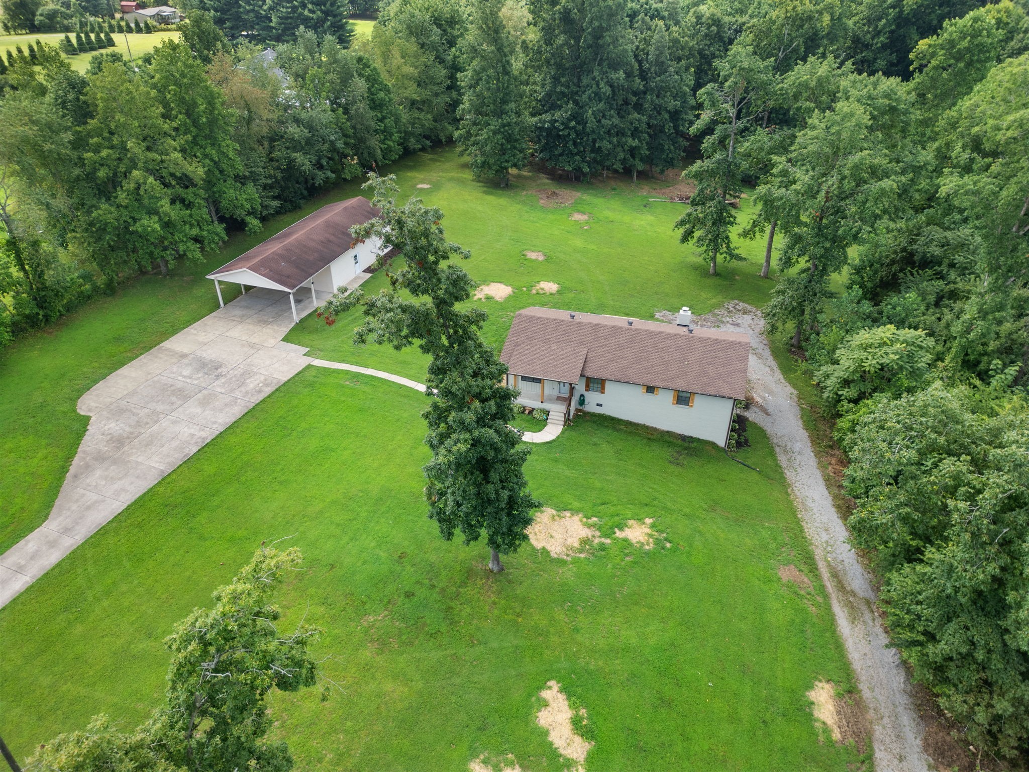 407 South Ray Road Portland, TN 37148 - Photo 46 of 47 a view of a garden with a house