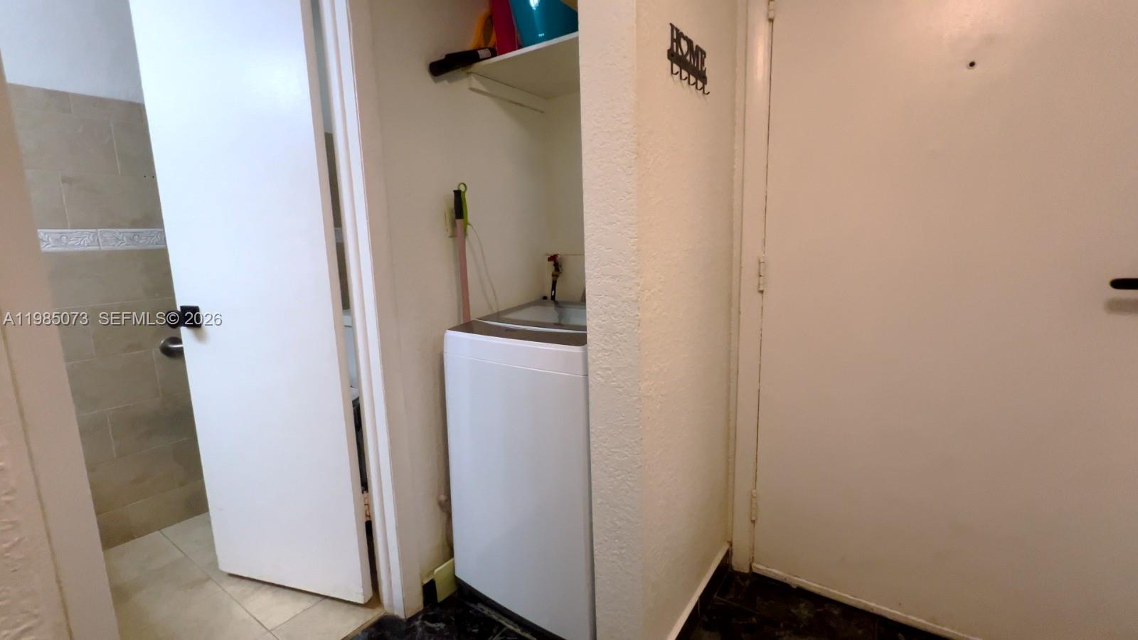 1900 West 68th Street, Unit D207 Hialeah, FL 33014 - Photo 12 of 33 a bathroom with a sink and shower