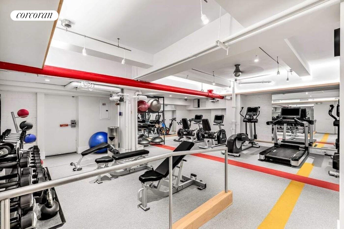 19 East 88th Street, Unit 4H Manhattan, NY 10128 - Photo 11 of 12 a view of a room with gym equipment