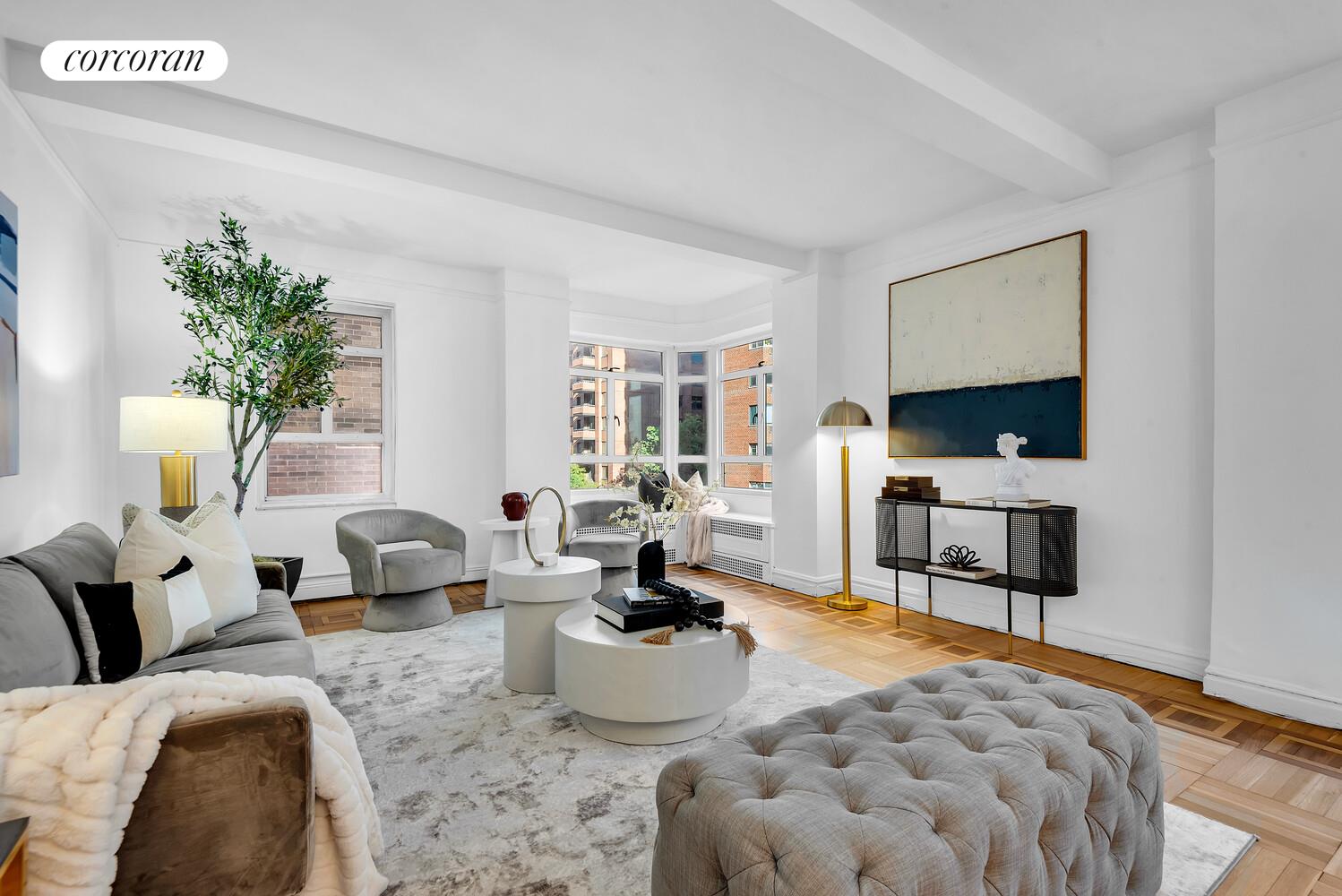 19 East 88th Street, Unit 4H Manhattan, NY 10128 - Photo 3 of 12 a living room with furniture and a lamp