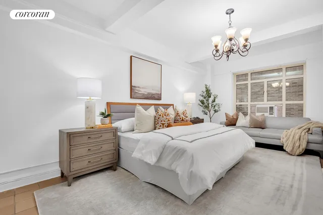 a large white kitchen with stainless steel appliances granite countertop a sink and a stove