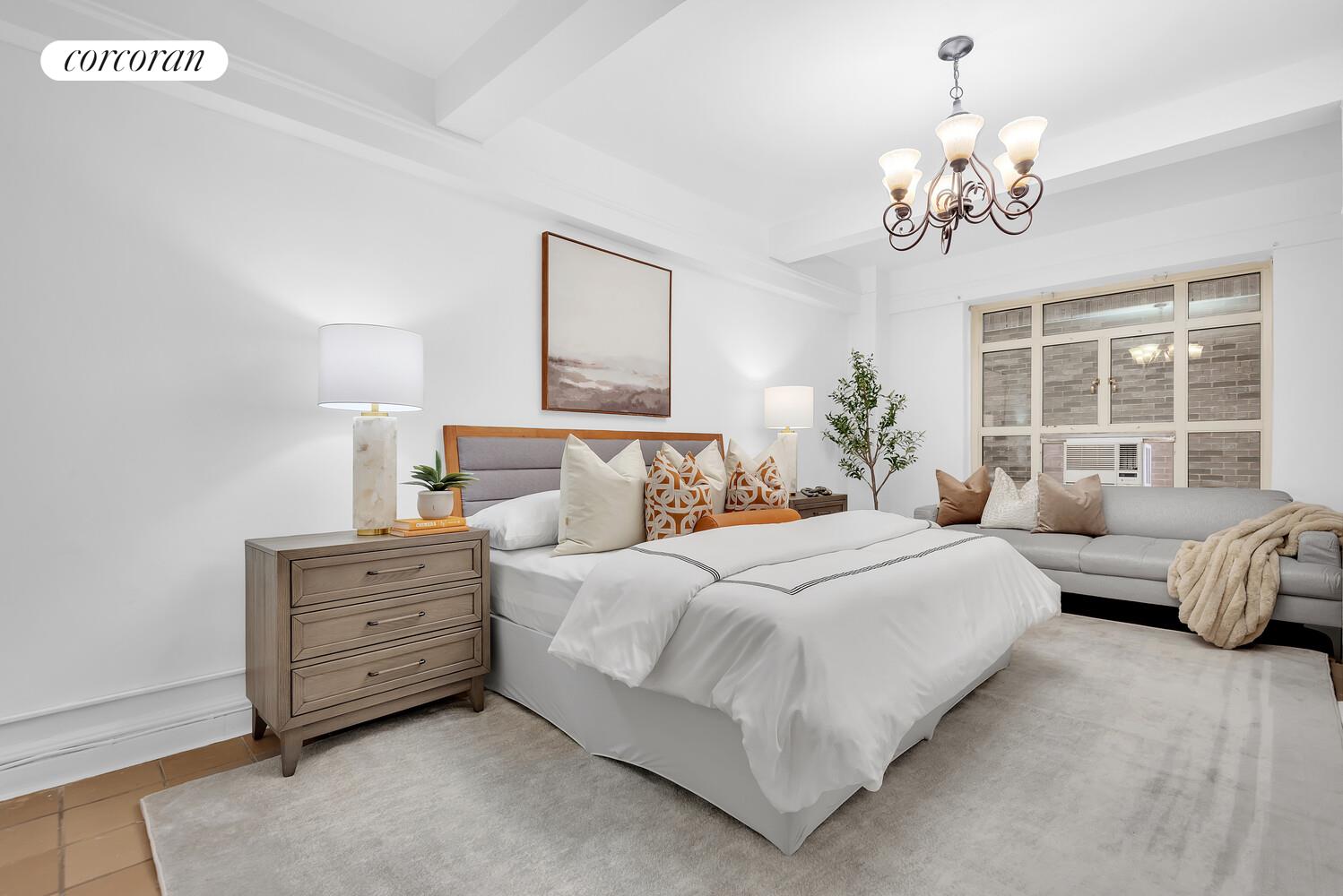 19 East 88th Street, Unit 4H Manhattan, NY 10128 - Photo 6 of 12 a bedroom with bed dresser and window