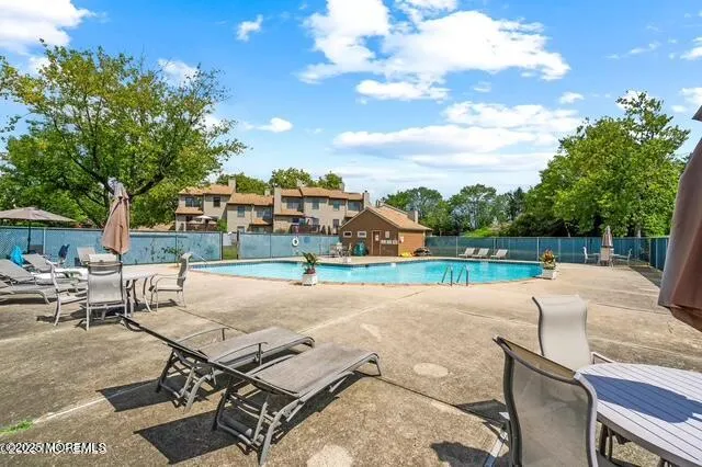 a view of a backyard with sitting area