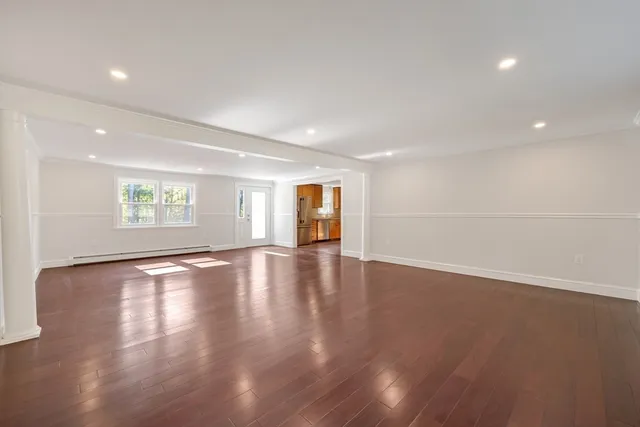 a large kitchen with cabinets and stainless steel appliances
