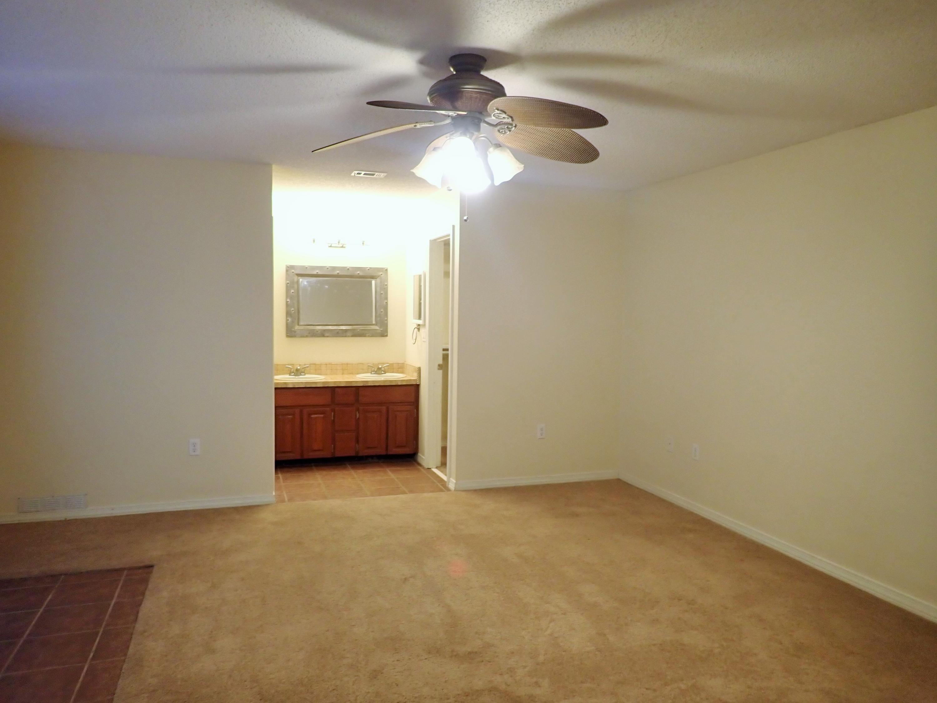 303 Sheldon Court Crestview, FL 32539 - Photo 12 of 45 a view of a room with a sink and a chandelier fan