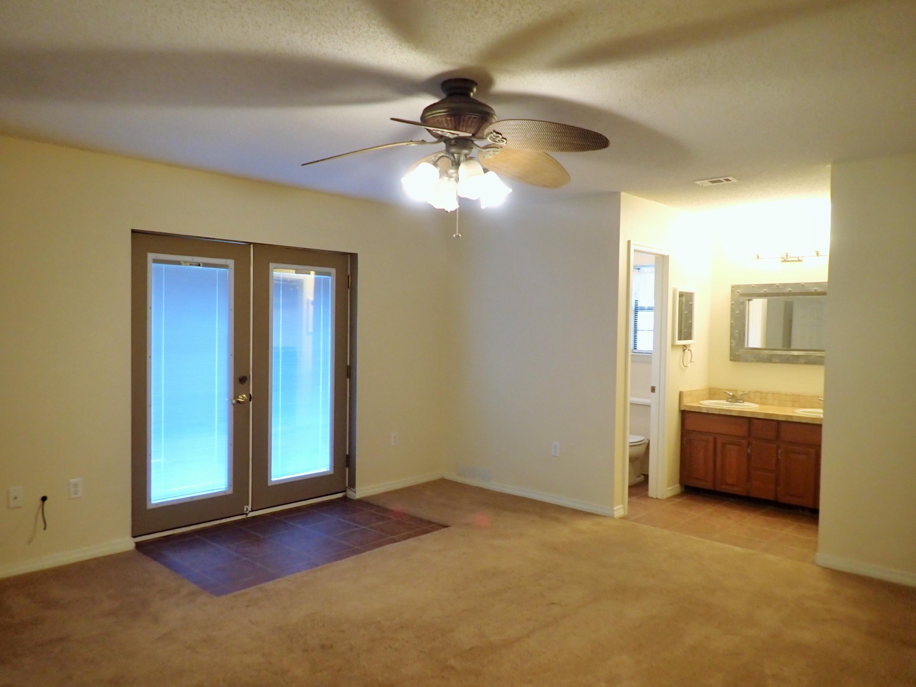 303 Sheldon Court Crestview, FL 32539 - Photo 13 of 45 a view of an empty room with a window