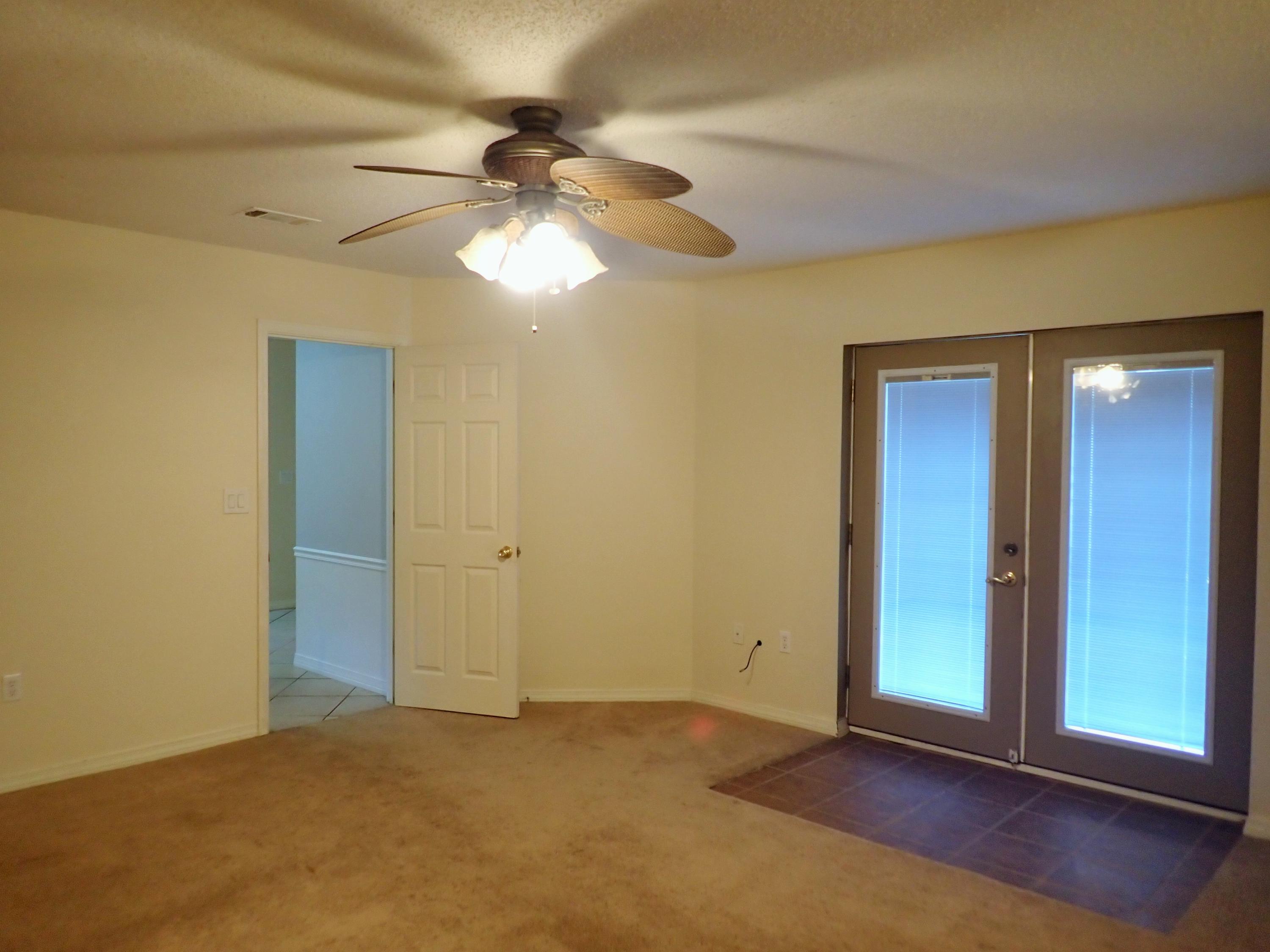 303 Sheldon Court Crestview, FL 32539 - Photo 14 of 45 an empty room with closet and wooden floor