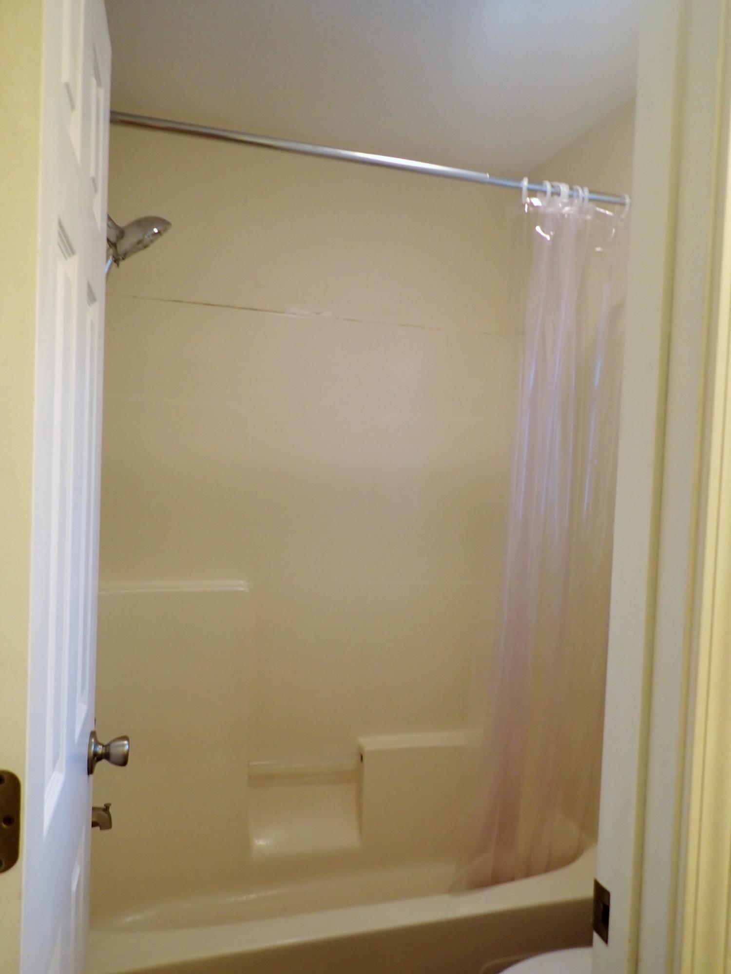 303 Sheldon Court Crestview, FL 32539 - Photo 16 of 45 a bathroom with a shower