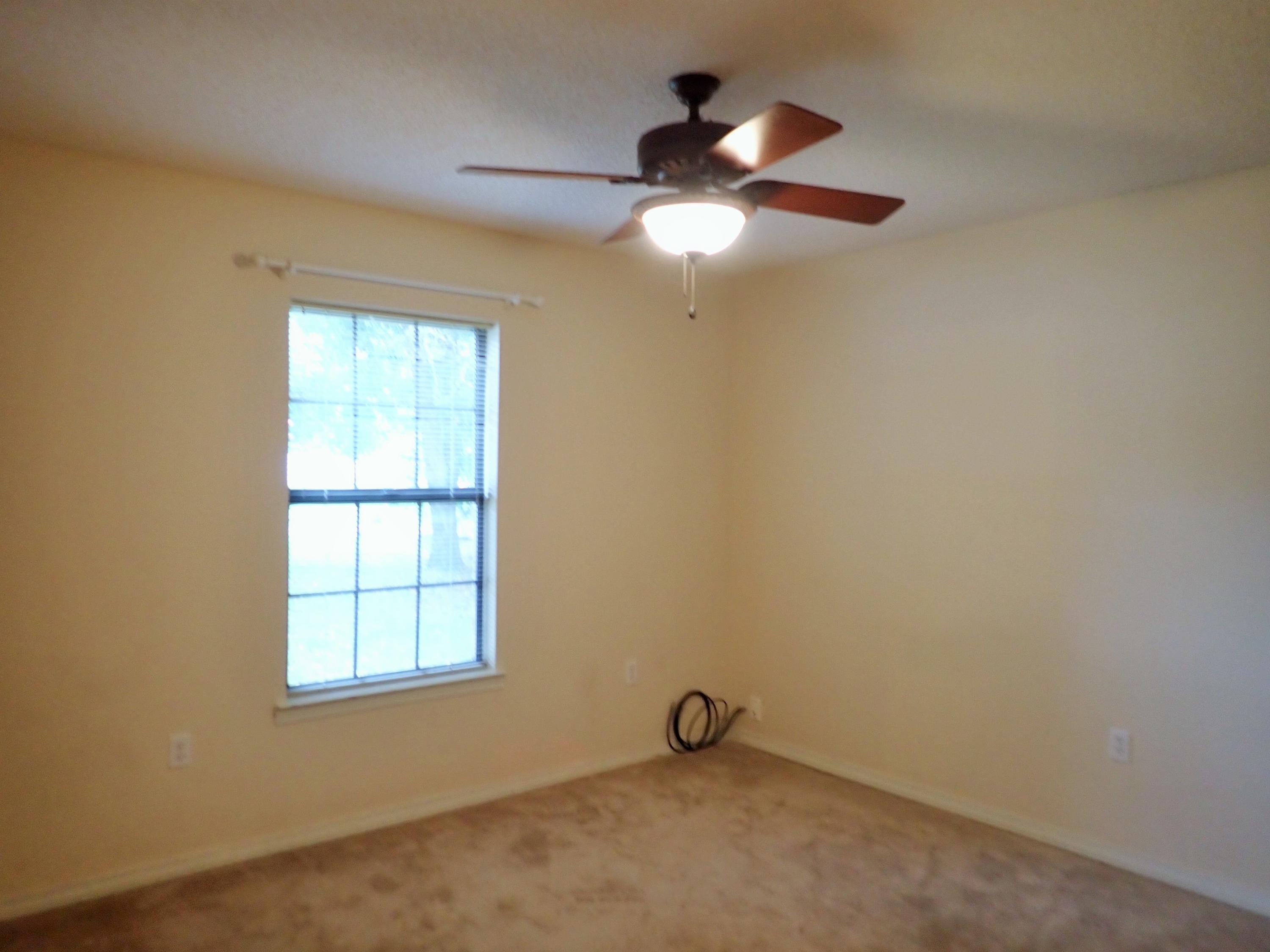 303 Sheldon Court Crestview, FL 32539 - Photo 17 of 45 an empty room with a window