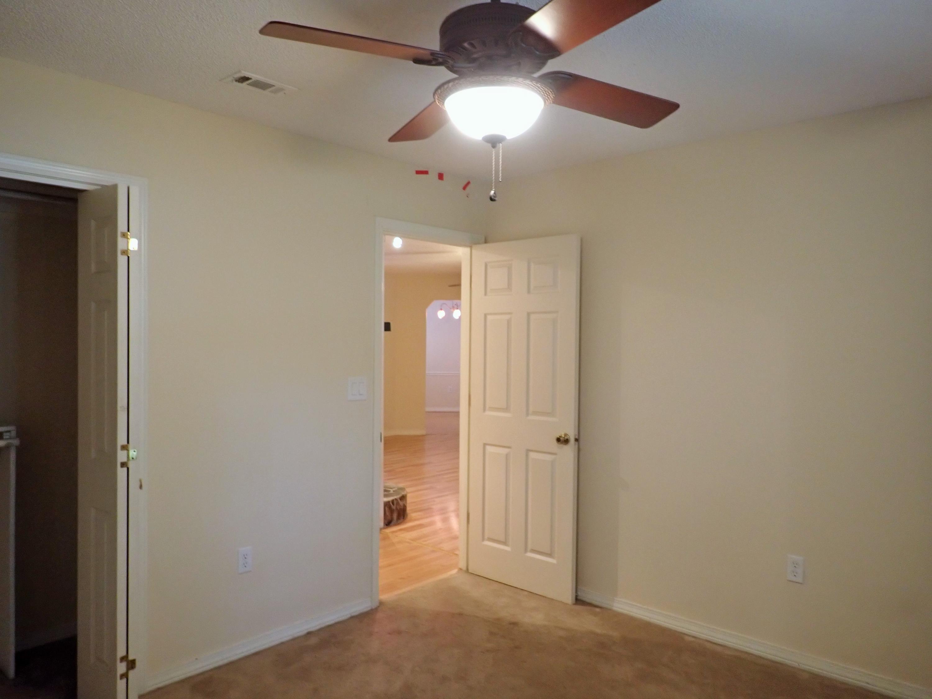 303 Sheldon Court Crestview, FL 32539 - Photo 20 of 45 en view of a chandelier fan and entryway