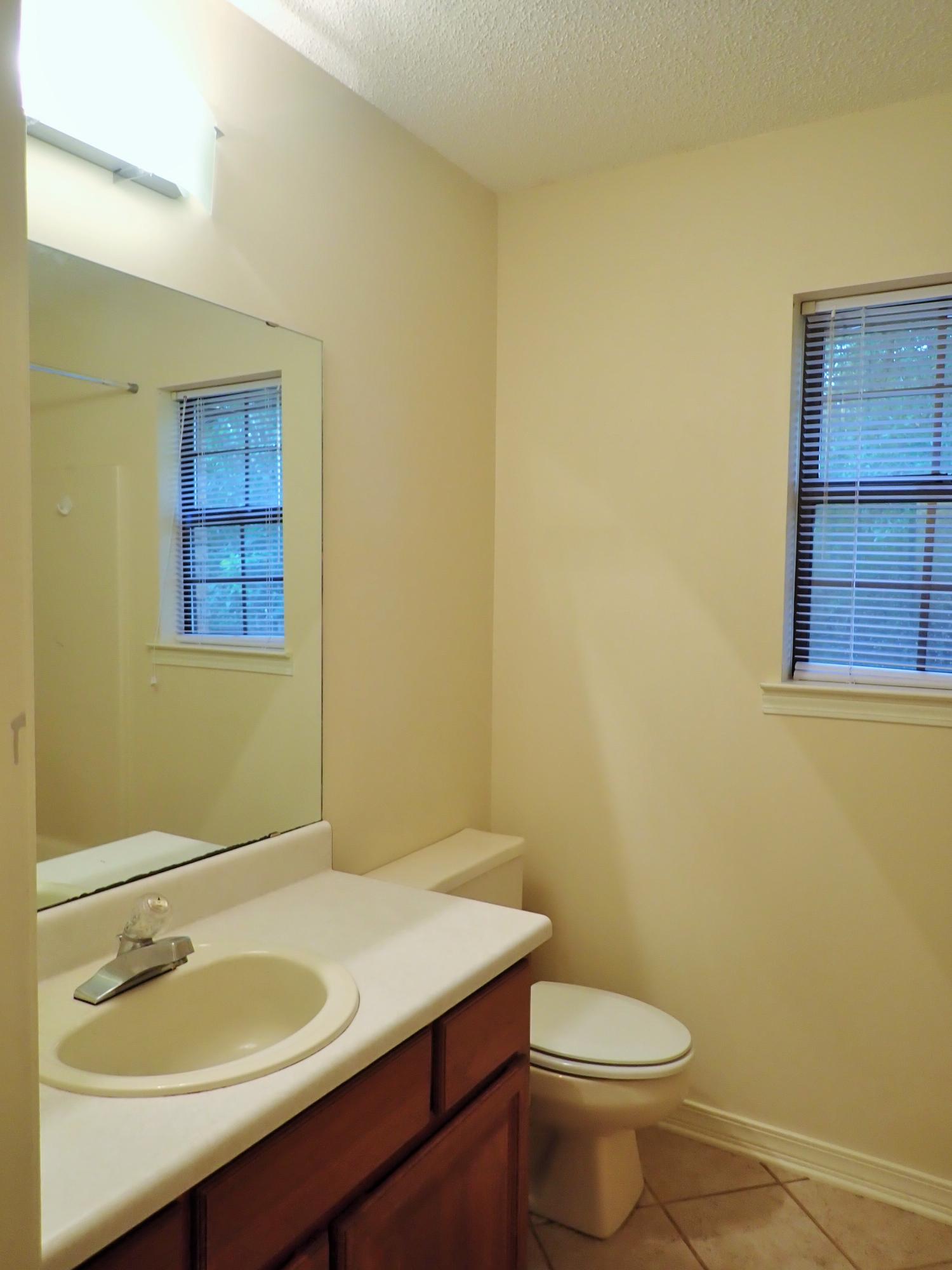 303 Sheldon Court Crestview, FL 32539 - Photo 22 of 45 a bathroom with a sink and a toilet