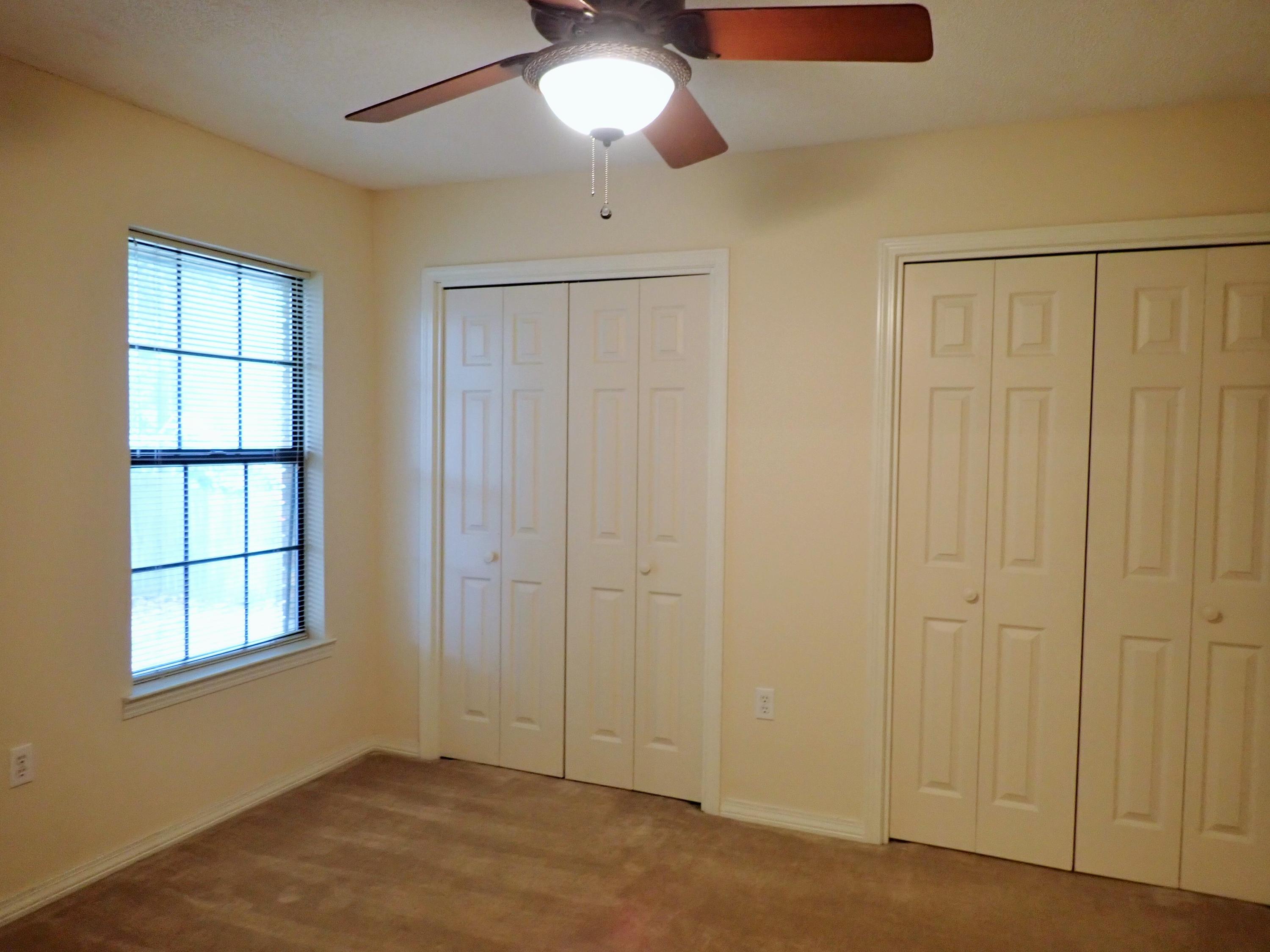 303 Sheldon Court Crestview, FL 32539 - Photo 24 of 45 a view of an empty room with a window