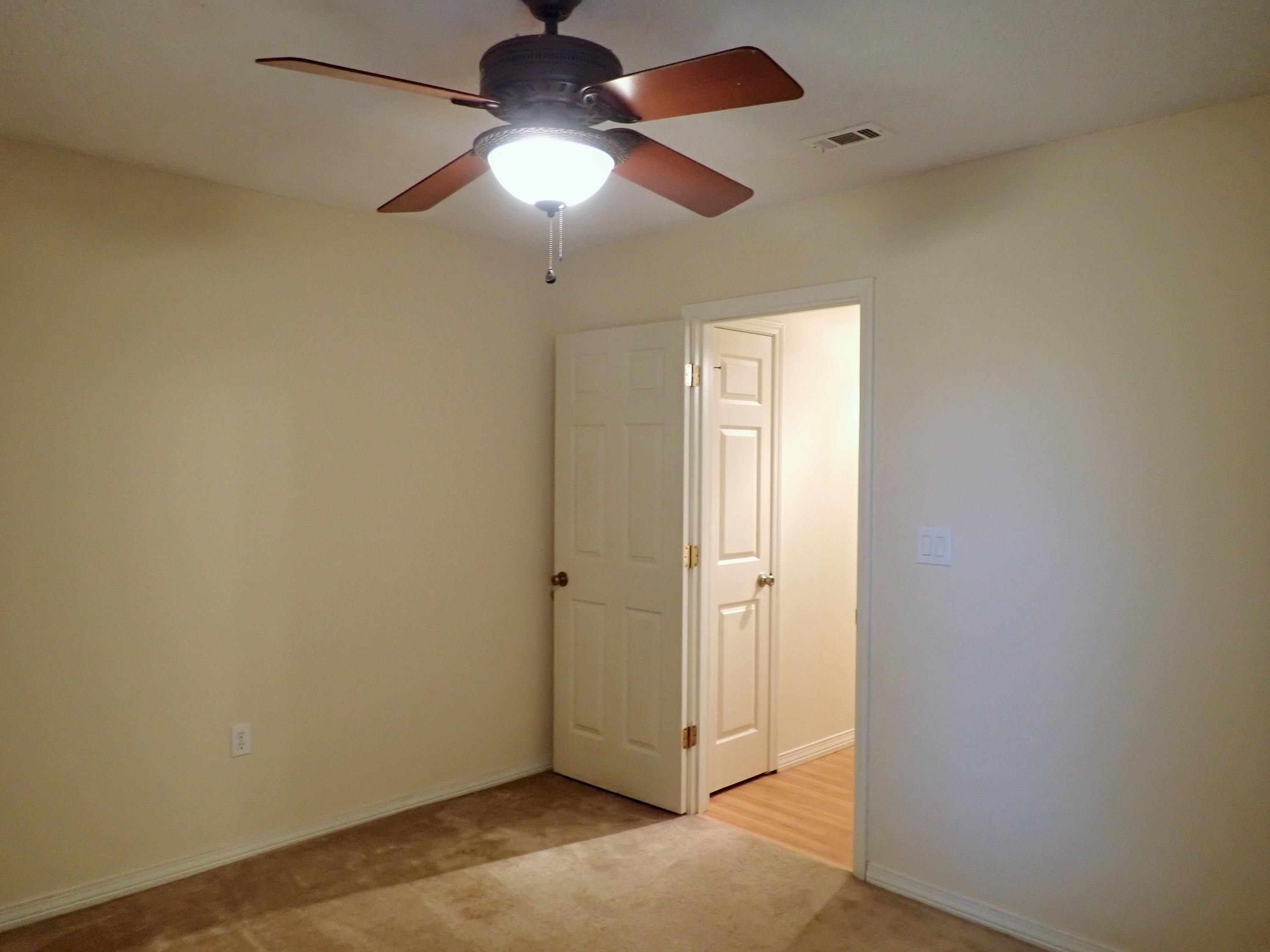 303 Sheldon Court Crestview, FL 32539 - Photo 25 of 45 an empty room with chandelier fan