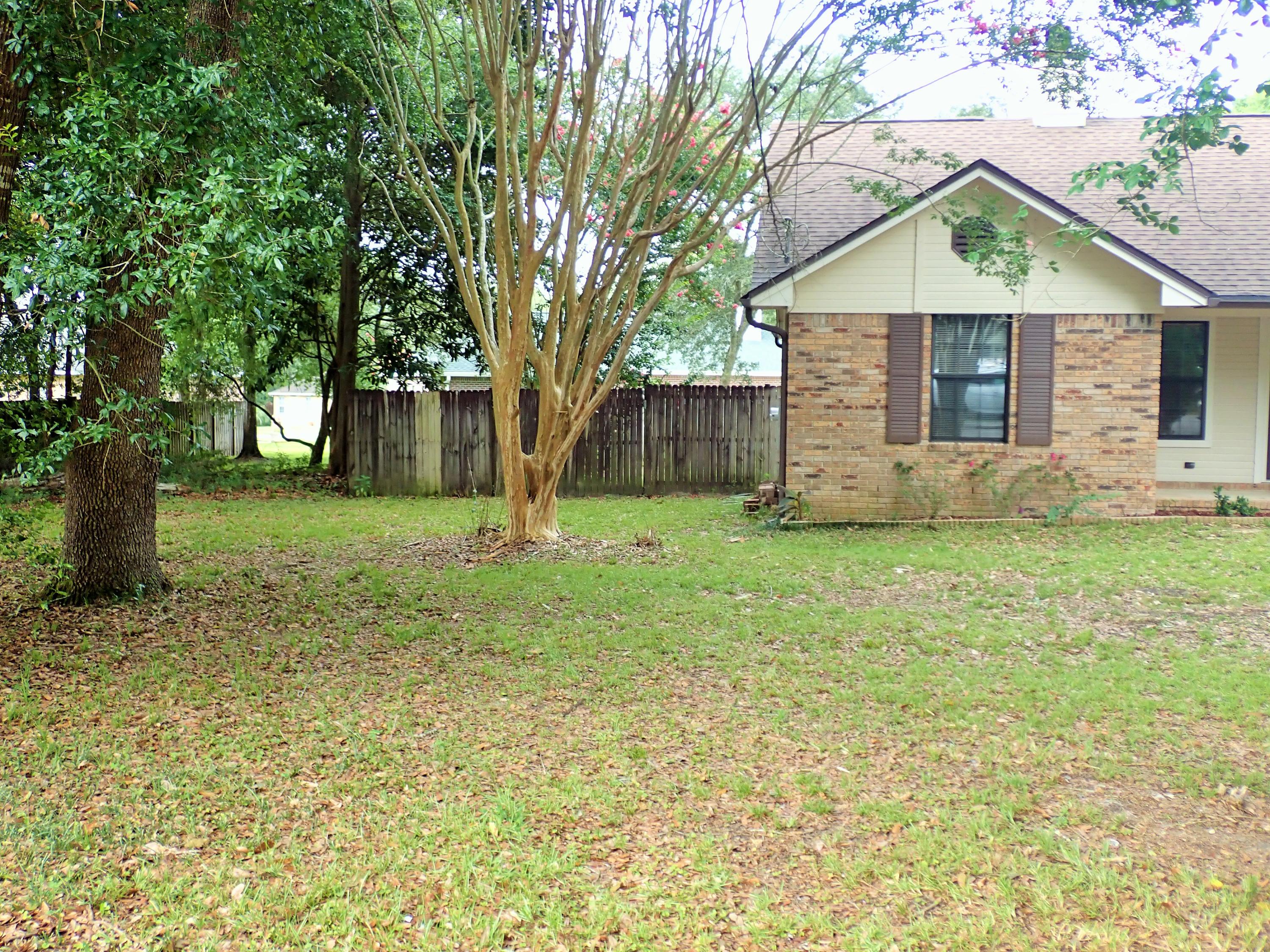 303 Sheldon Court Crestview, FL 32539 - Photo 4 of 45 a front view of house with yard and green space
