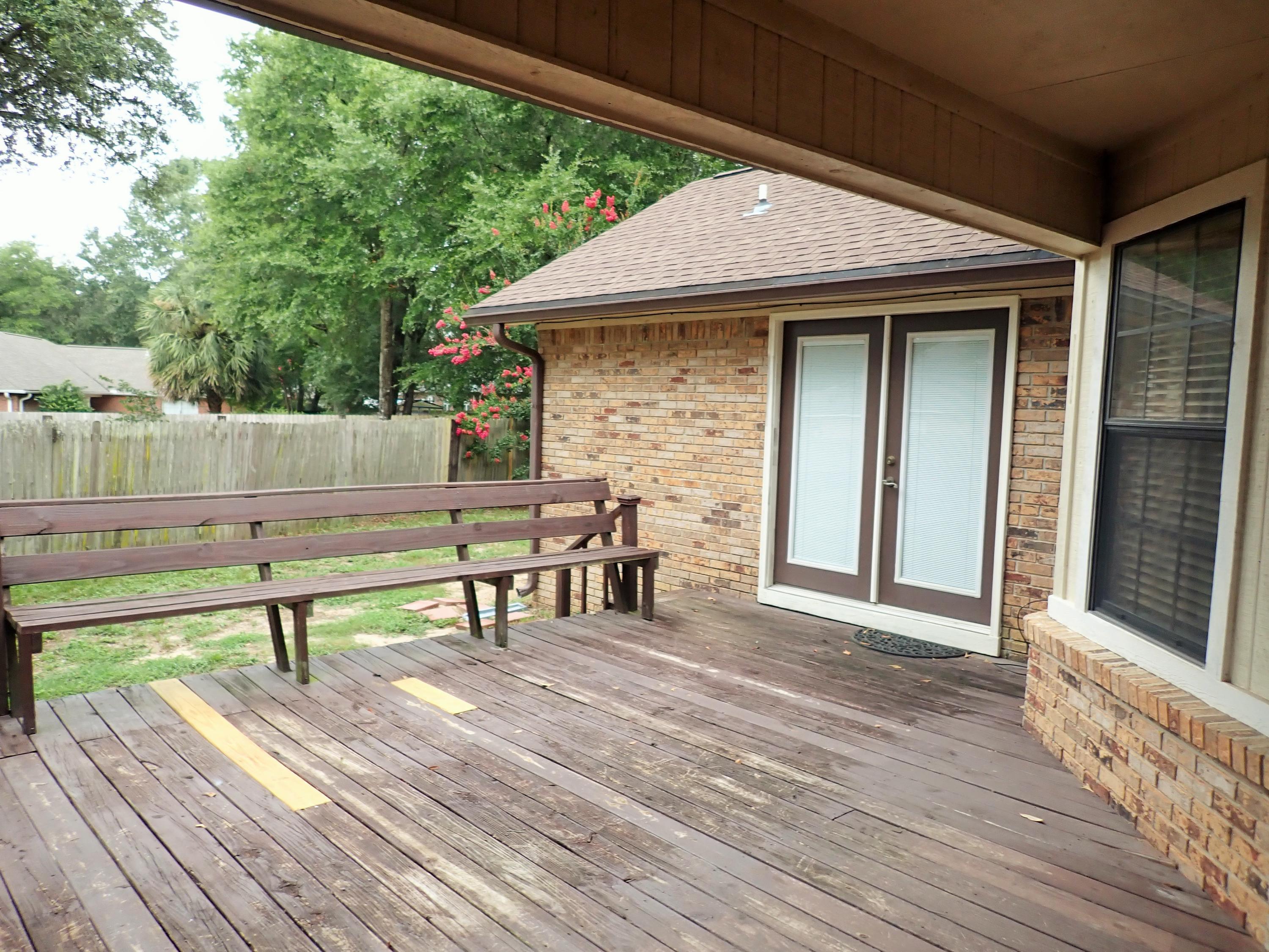 303 Sheldon Court Crestview, FL 32539 - Photo 33 of 45 a view of a terrace with seating area
