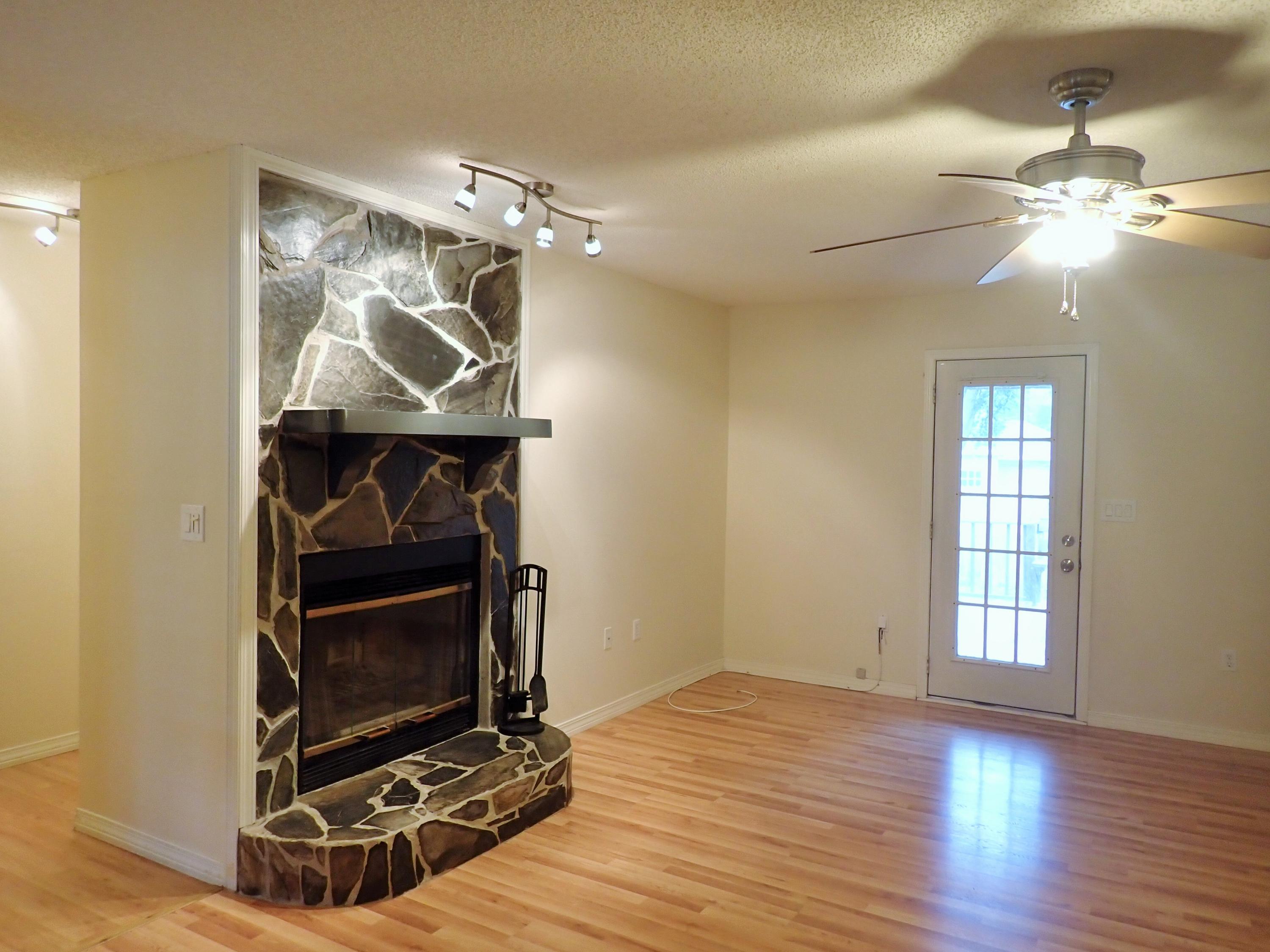 303 Sheldon Court Crestview, FL 32539 - Photo 5 of 45 a room with wooden floor and chandelier