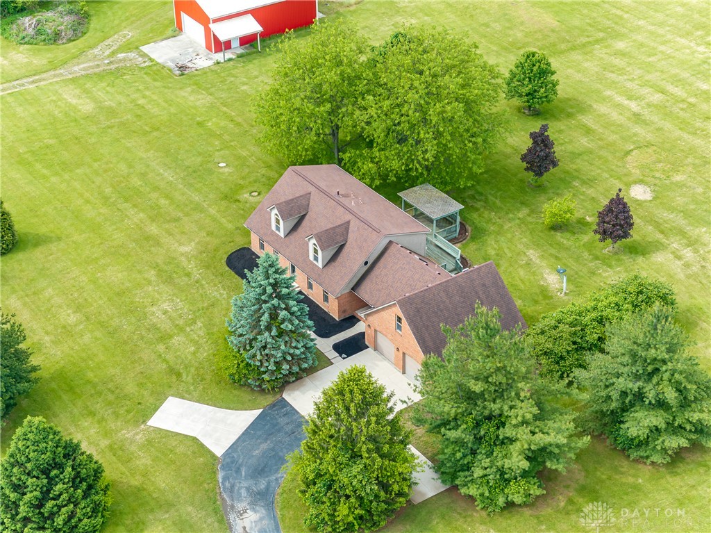 9981 Ridge Acres Lane Englewood, OH 45322 - Photo 59 of 73 This expansive estate features a charming home nestled among lush greenery, offering serene rural living.