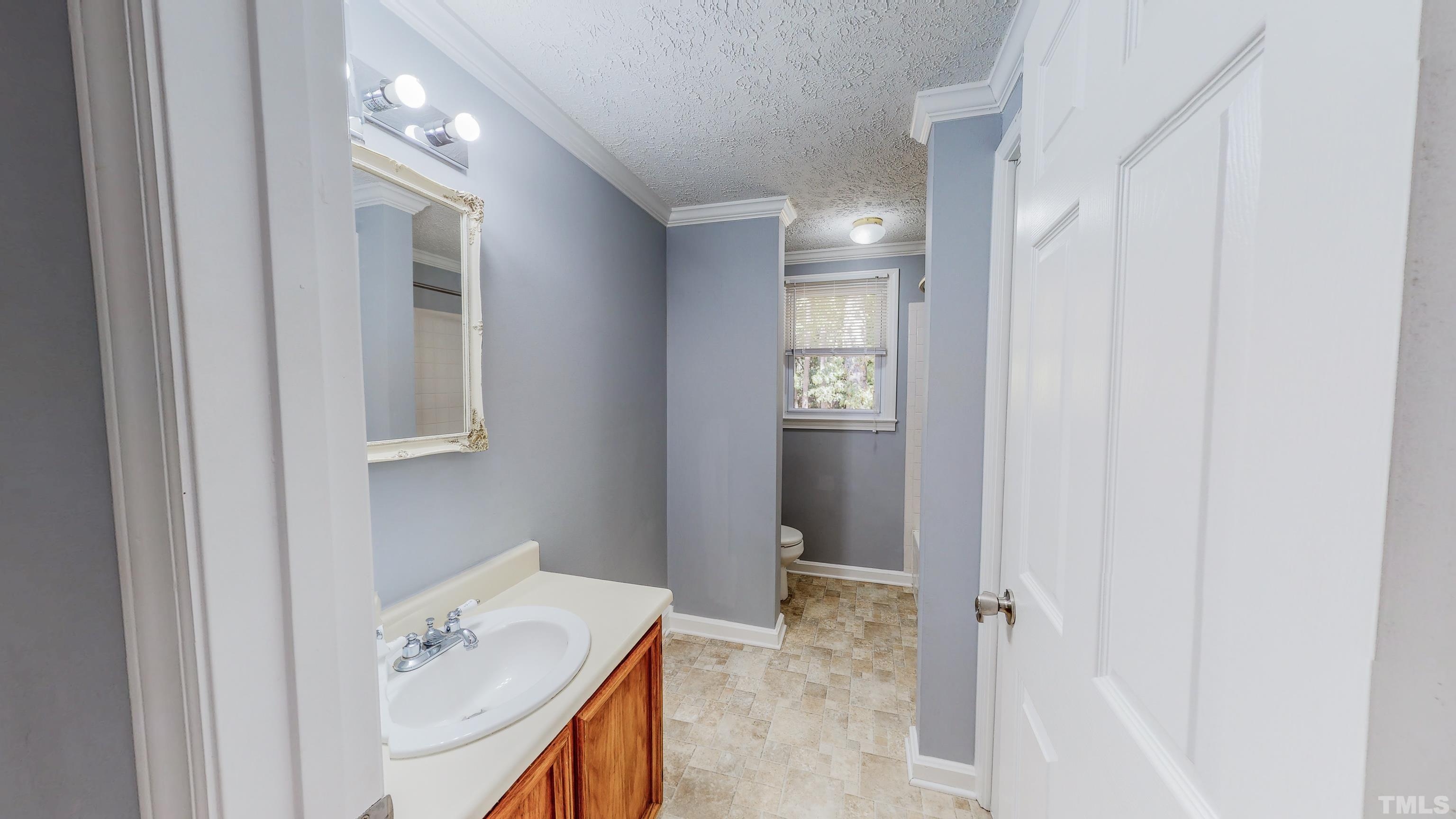 180 Dancy Day Road Roxboro, NC 27574 - Photo 27 of 30 a bathroom with a sink vanity and tub
