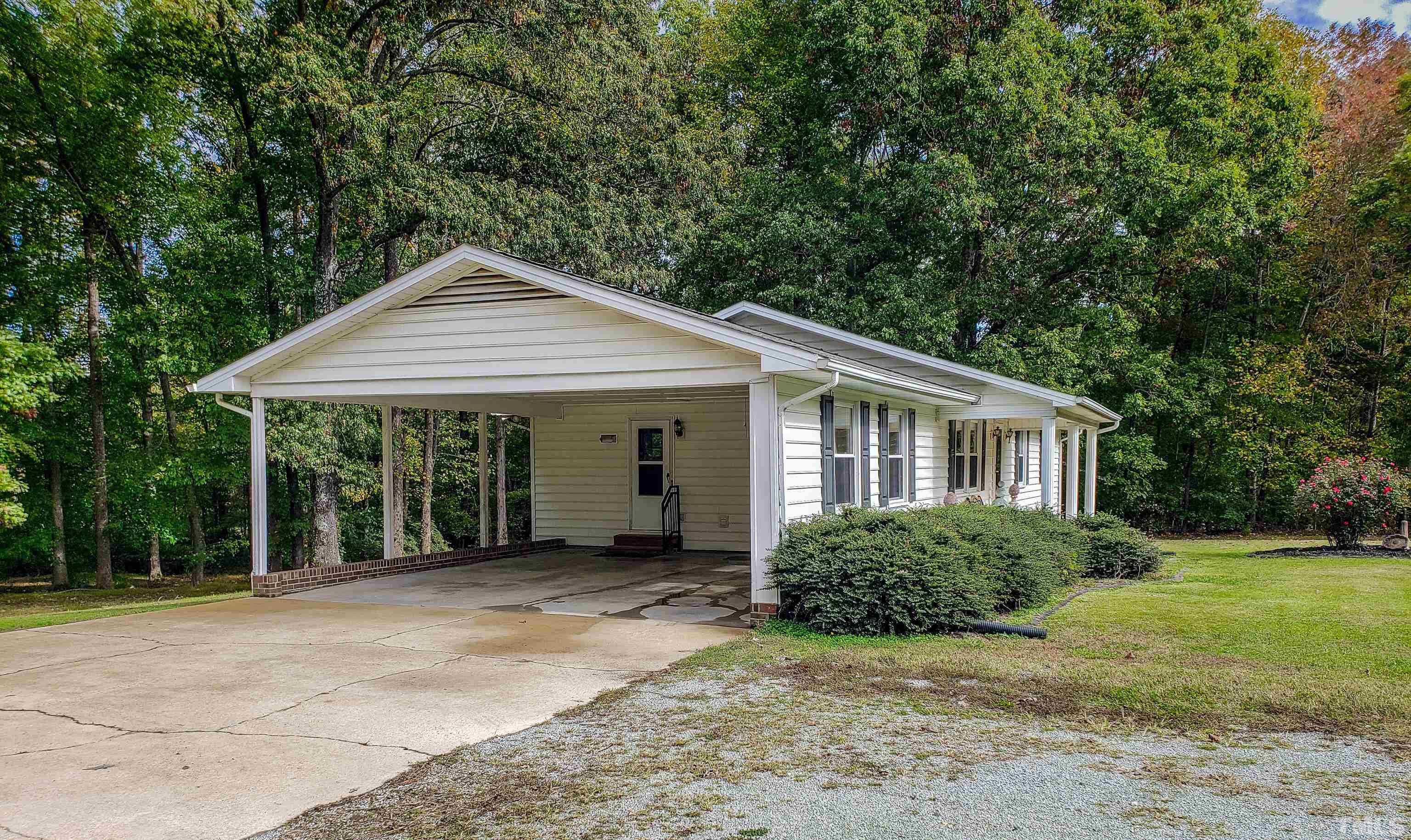 180 Dancy Day Road Roxboro, NC 27574 - Photo 30 of 30 a front view of a house with garden