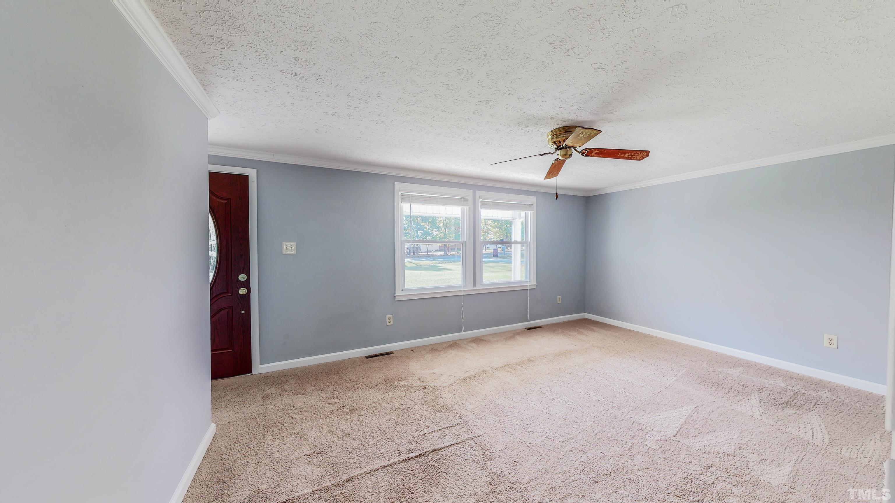 180 Dancy Day Road Roxboro, NC 27574 - Photo 6 of 30 an empty room with windows and closet