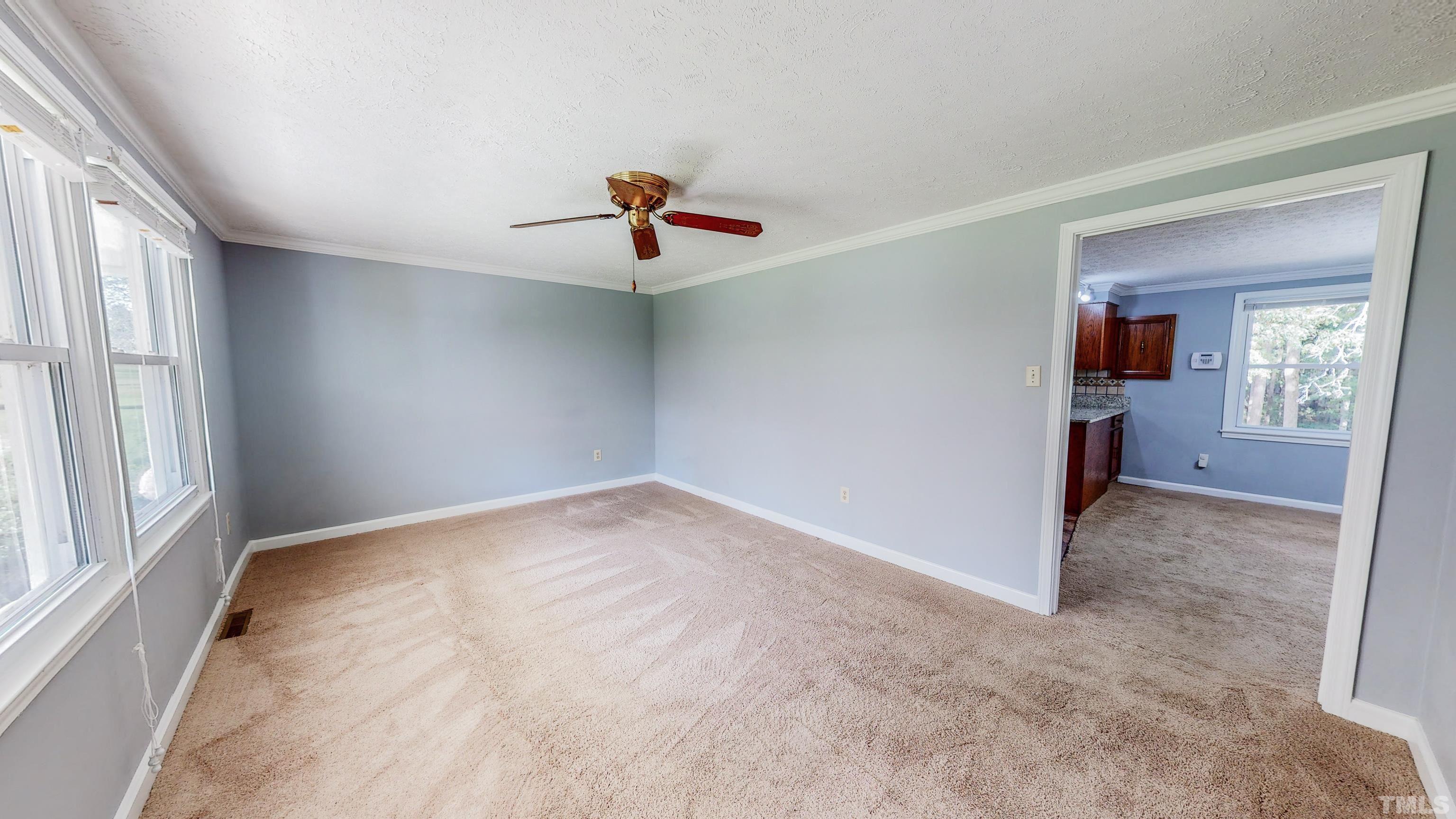 180 Dancy Day Road Roxboro, NC 27574 - Photo 7 of 30 wooden floor in an empty room with a window