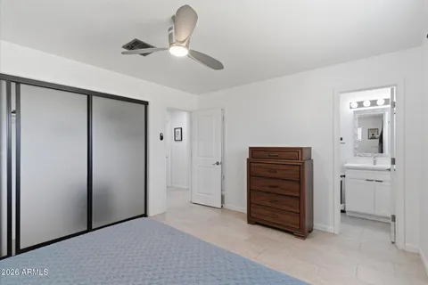 a bedroom with a bed and window