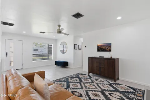 a view of a living room a rug and a window