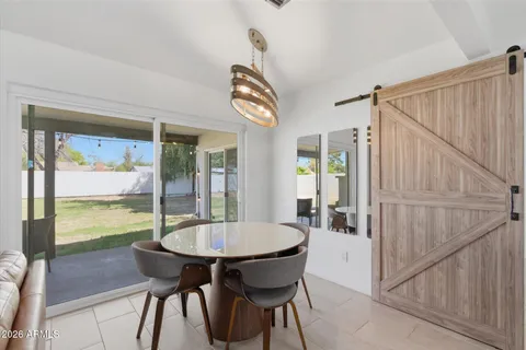 a kitchen with stainless steel appliances granite countertop a sink and a stove