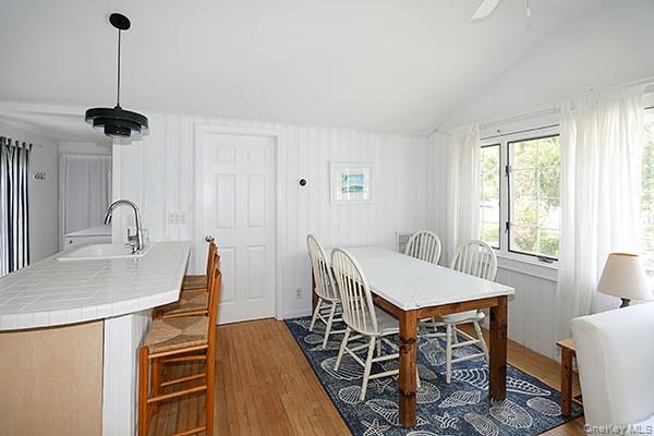 14 Lincoln Road Hampton Bays, NY 11946 - Photo 13 of 34 a view of a dining room with furniture window and wooden floor