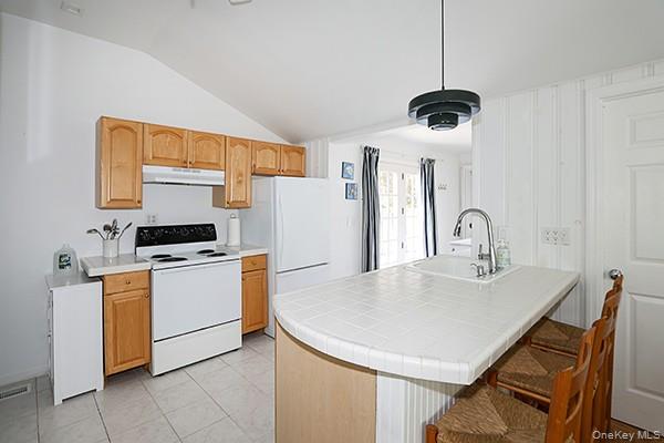 14 Lincoln Road Hampton Bays, NY 11946 - Photo 19 of 34 a kitchen that has a microwave a sink and a stove