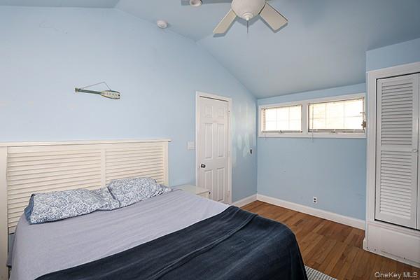 14 Lincoln Road Hampton Bays, NY 11946 - Photo 21 of 34 a bedroom with a bed and a window
