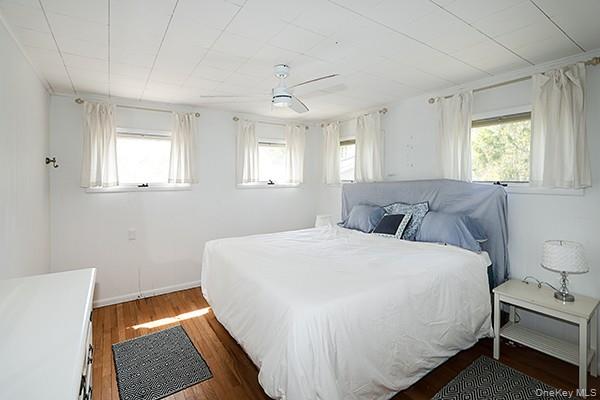 14 Lincoln Road Hampton Bays, NY 11946 - Photo 22 of 34 a bedroom with a bed and a window