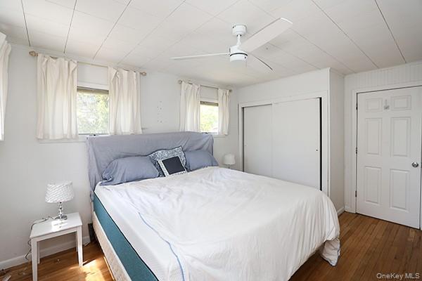 14 Lincoln Road Hampton Bays, NY 11946 - Photo 24 of 34 a bed room with a bed and a window