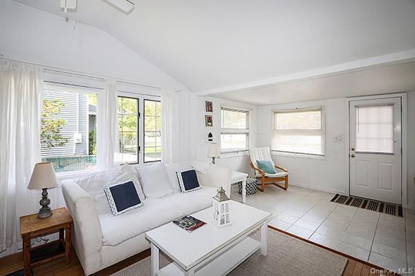14 Lincoln Road Hampton Bays, NY 11946 - Photo 29 of 34 a living room with furniture and a window