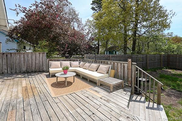 14 Lincoln Road Hampton Bays, NY 11946 - Photo 30 of 34 a view of deck with chairs and wooden floor