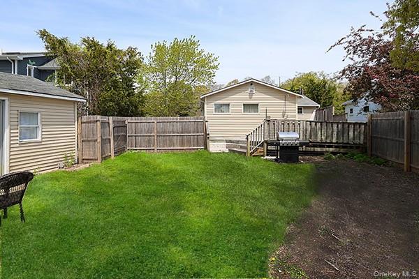14 Lincoln Road Hampton Bays, NY 11946 - Photo 3 of 34 a view of a house with a yard and sitting area