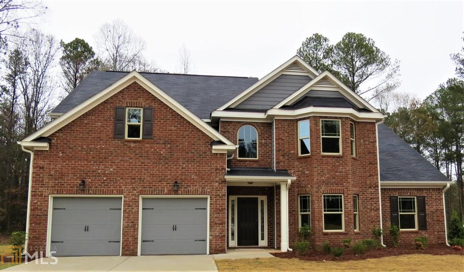 80 Cowan Ridge, Unit 7 Covington, GA 30016 - Photo 1 of 1 a front view of a house with a yard