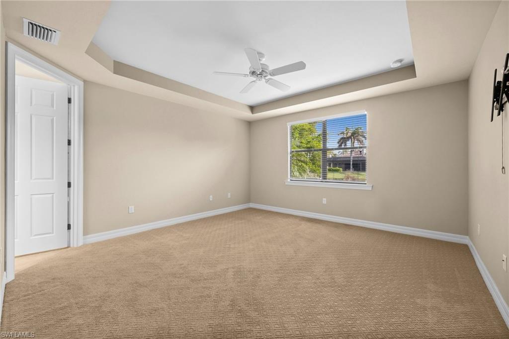 14650 Laguna Drive Fort Myers, FL 33908 - Photo 27 of 50 an empty room with windows and fan