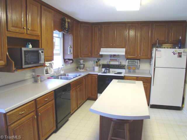 5509 Stonebridge Road Pleasant Garden, NC 27313 - Photo 4 of 9 Other. Large kitchen with plenty of oak cabinets and island.