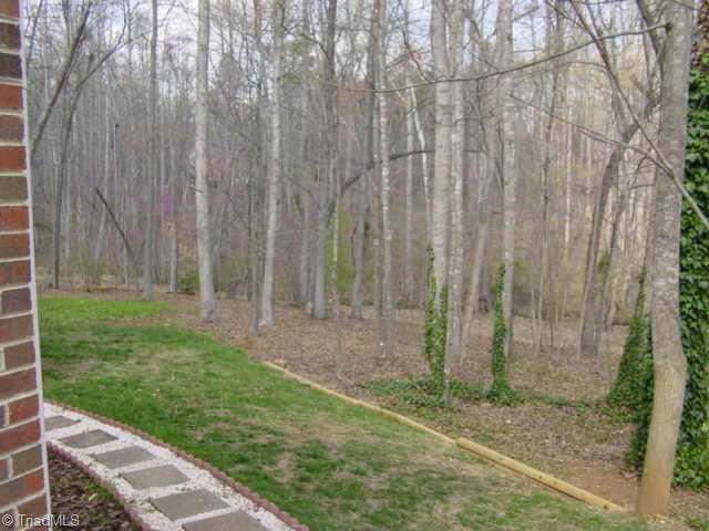 5509 Stonebridge Road Pleasant Garden, NC 27313 - Photo 7 of 9 Other. Gorgeous back yard with tall trees, a large two tiered deck to entertain on and a stream that leads to a lake!