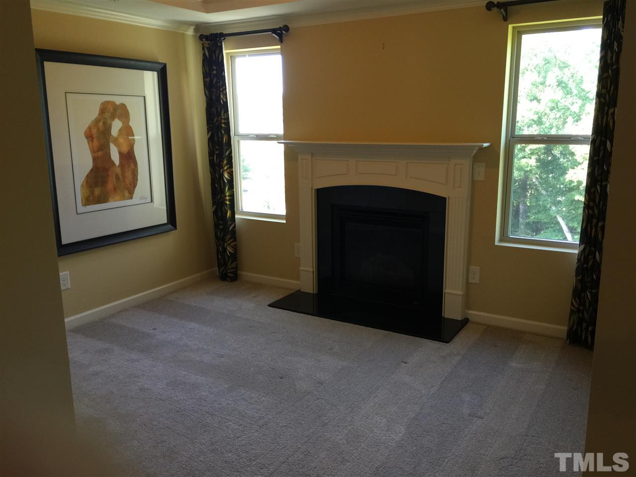 1314 Ranchester Road Knightdale, NC 27545 - Photo 17 of 25 a view of a livingroom with a fireplace