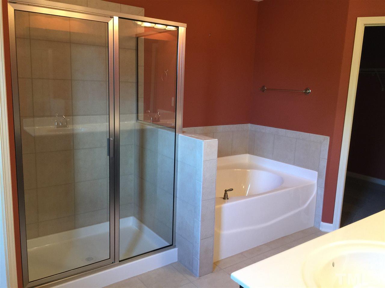 1314 Ranchester Road Knightdale, NC 27545 - Photo 18 of 25 a bathroom with a bathtub and a shower
