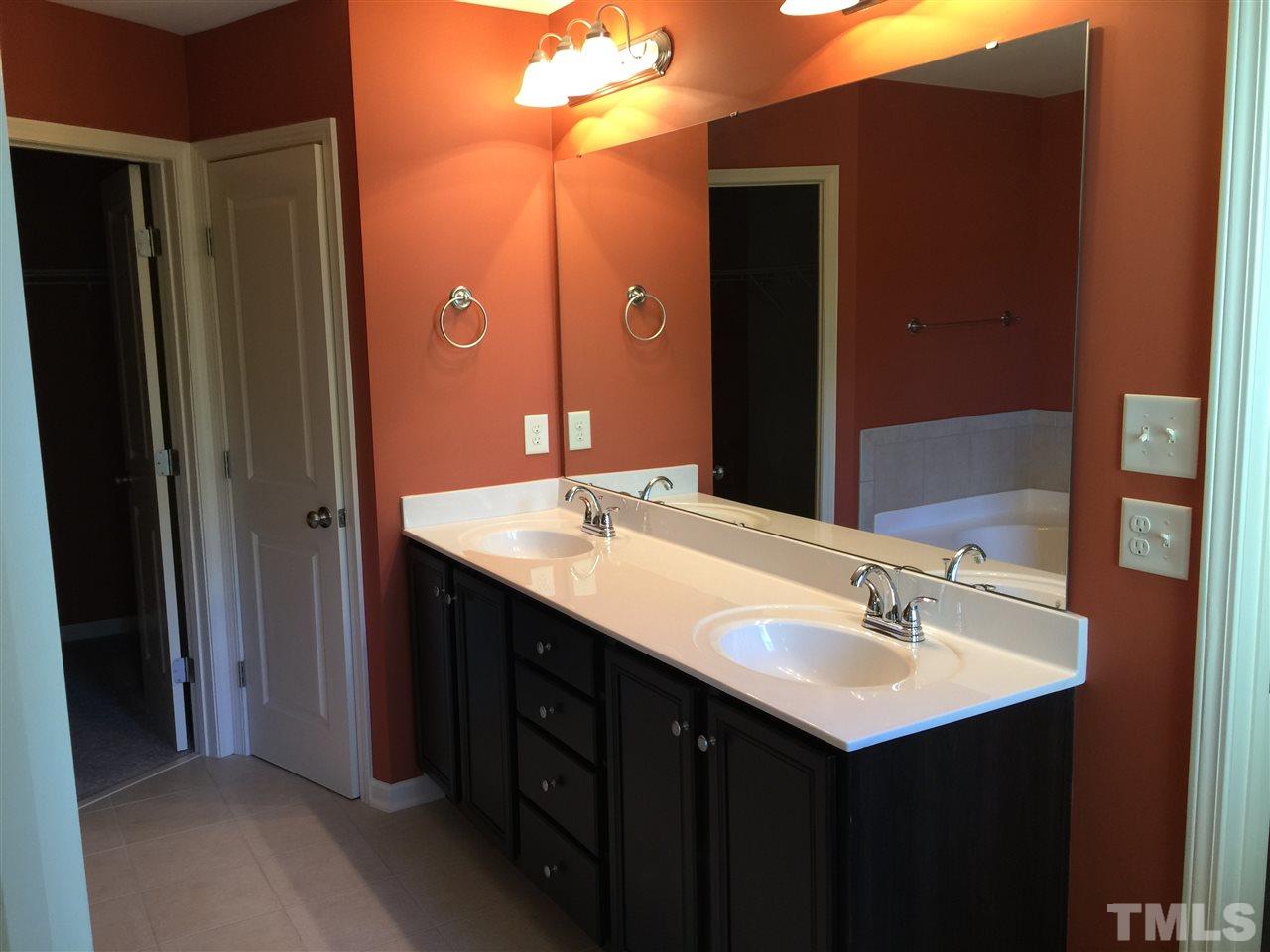 1314 Ranchester Road Knightdale, NC 27545 - Photo 19 of 25 a bathroom with a sink and a mirror
