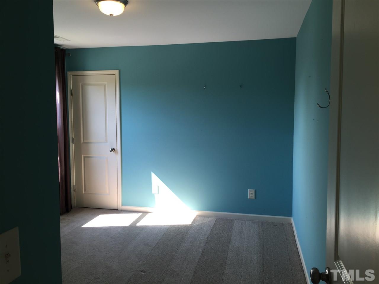 1314 Ranchester Road Knightdale, NC 27545 - Photo 23 of 25 a view of an empty room with wooden floor