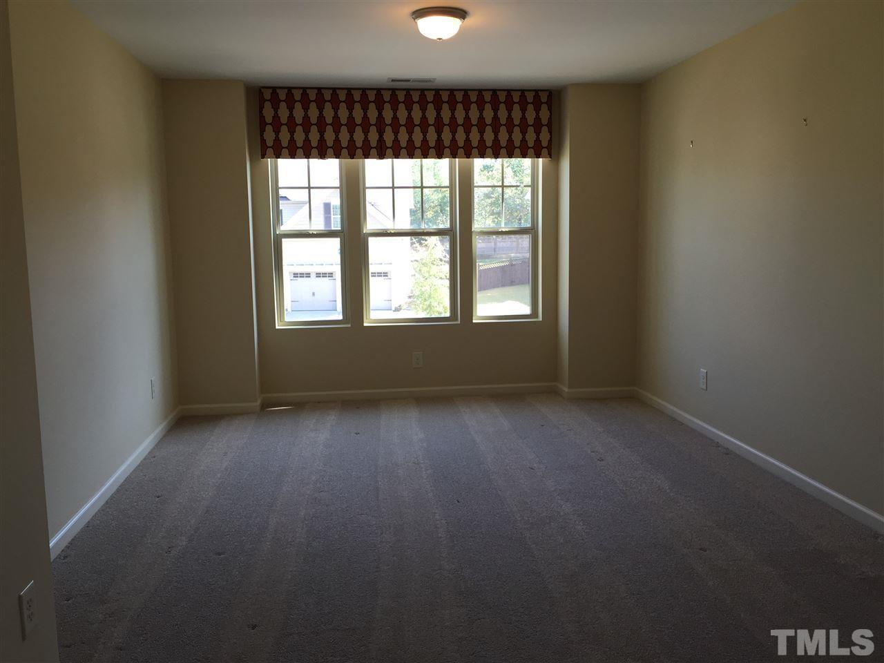 1314 Ranchester Road Knightdale, NC 27545 - Photo 24 of 25 an empty room with a window