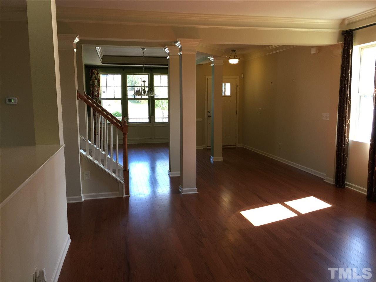 1314 Ranchester Road Knightdale, NC 27545 - Photo 10 of 25 wooden floor in an empty room with a window